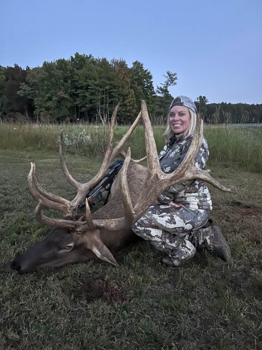 Female hunter with deer