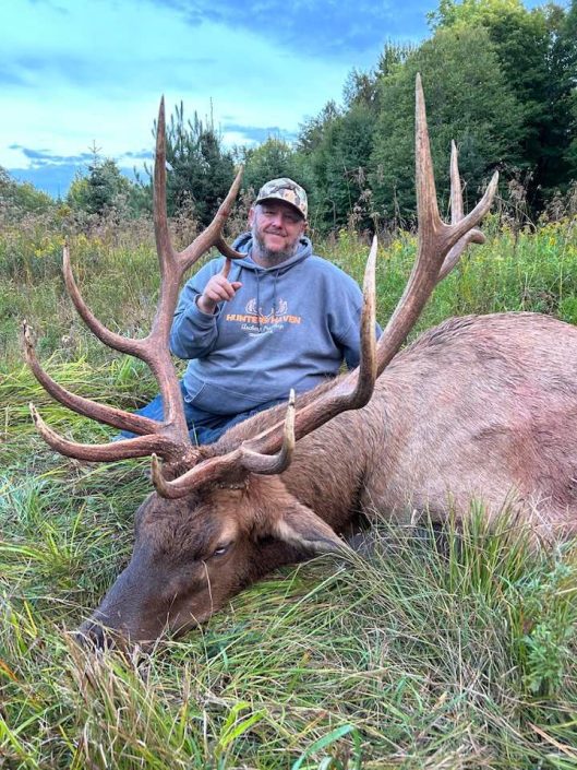 Man with trophy bull