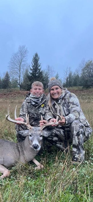 Mother and son with trophy buck