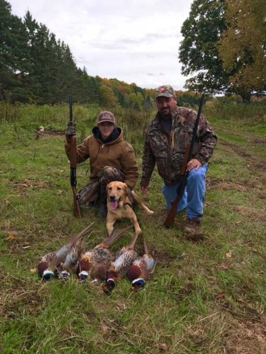 two people with waterfowl trophies