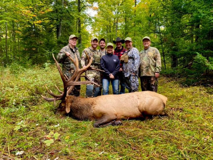 Group posing with Bull Group Trophy Hunt