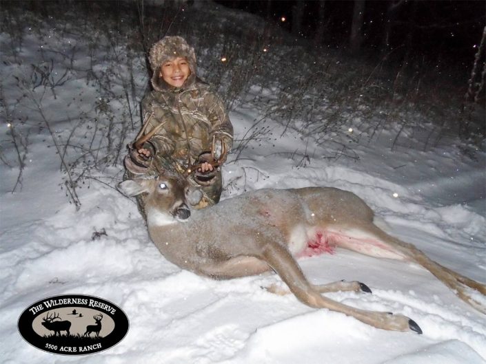 a hunter with the whitetail they have hunted 