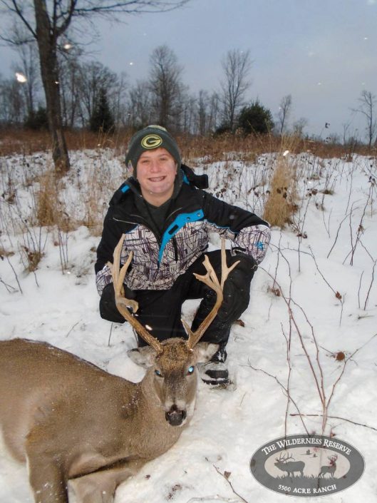 a hunter with their whitetail trophy kill 