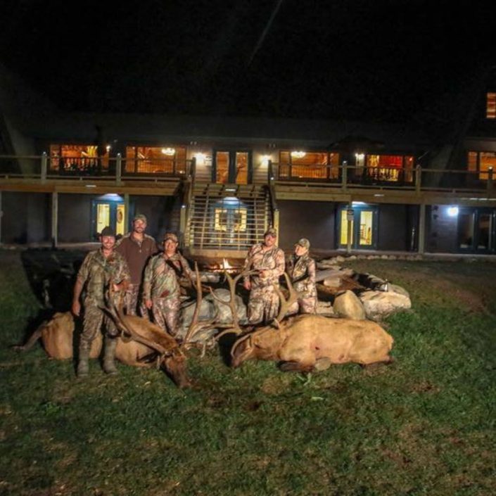 a group poses their their trophy kills 