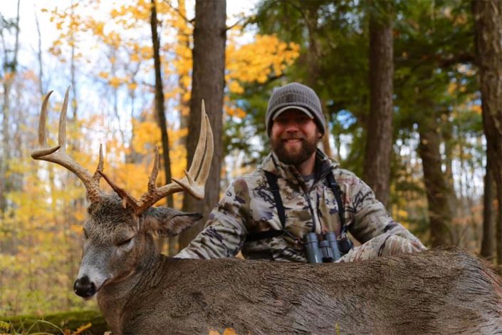 a hunter shows his buck 