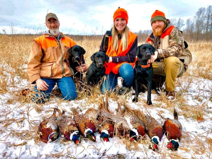 a group with their pheasant kills 