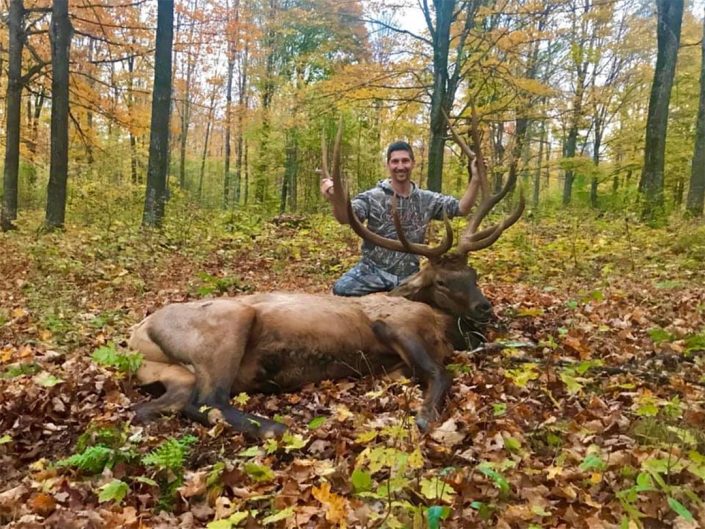 A man with an elk trophy