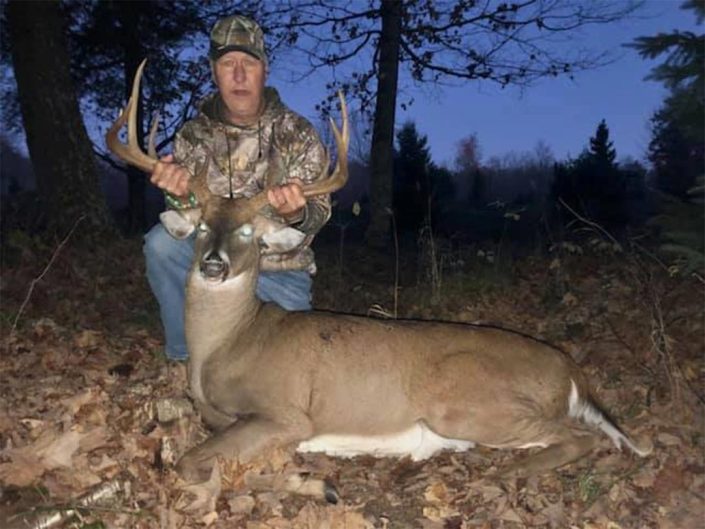 A man with his whitetail trophy