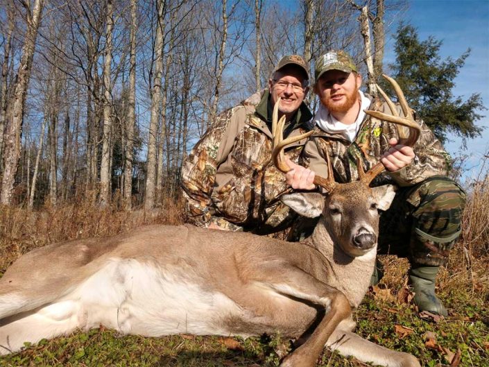 two hunters with a whitetail 