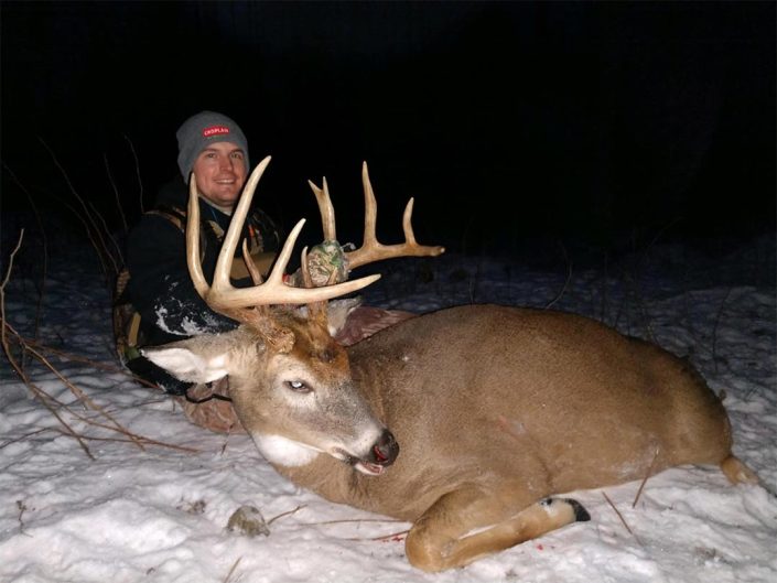 A hunter with a whitetail 
