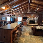 Whitetail cabin living area and bar interior
