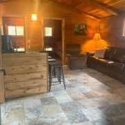 wide angle of kitchen and living room wolf cabin